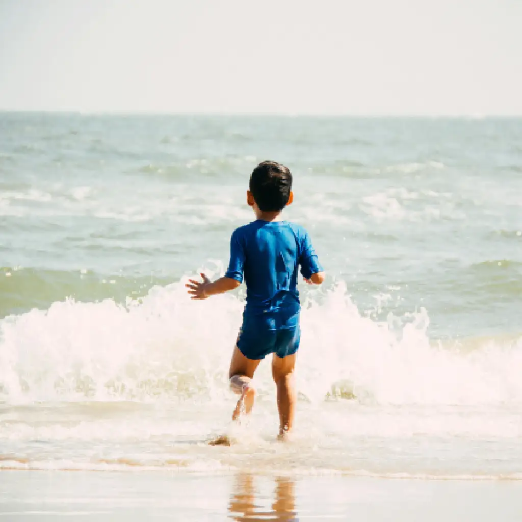 Child Playing in Waves